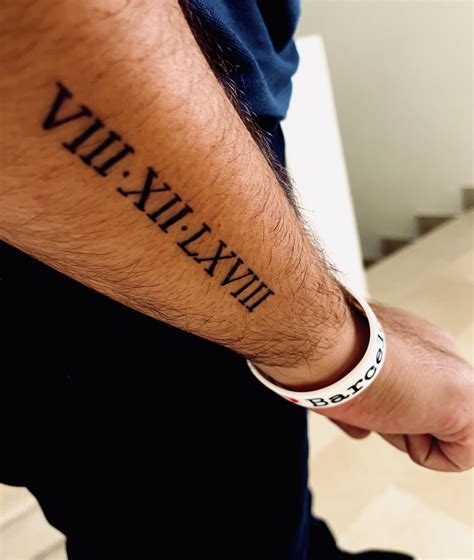 Forearm Male Roman Numerals Tattoo