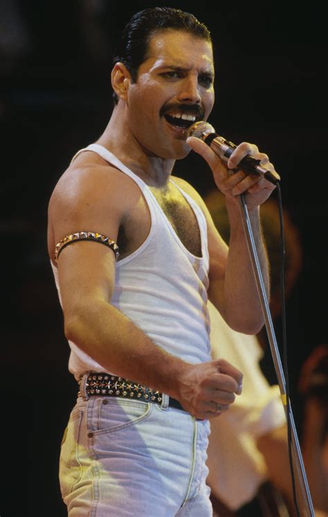 Freddie Mercury singing on stage