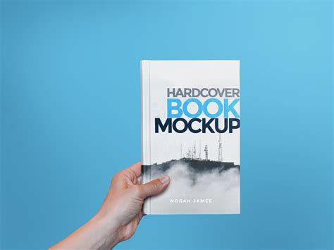 Download Free Hardcover Book in a Hand Mockup PSD Generator