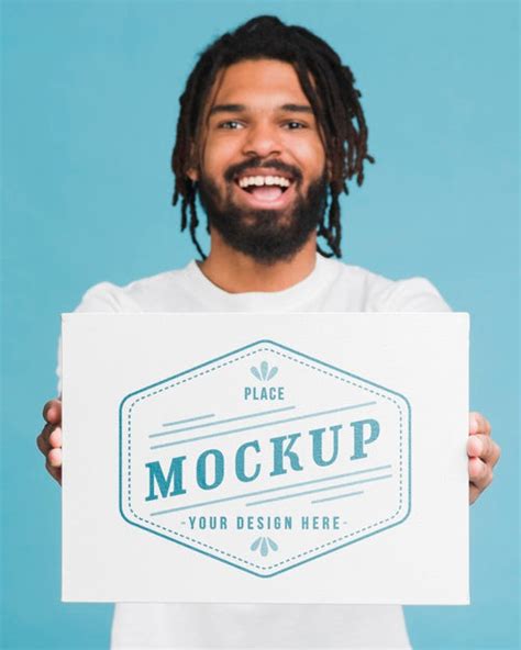 Download Free Man With A4 Poster Mockup PSD Generator