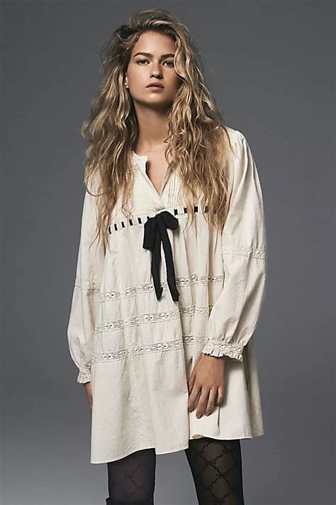 Indulge in Breezy Elegance: Elevate Your Tea Time in Free People's Stunning Mini Dress