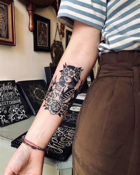 Front and back mechanical arm tattoo by Audrey Mello