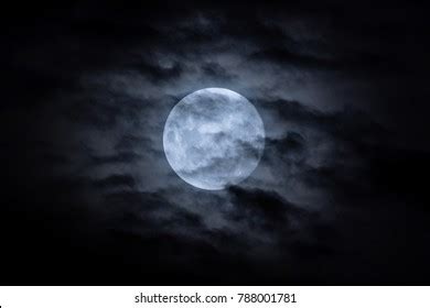 Full Moon Shining Through Clouds
