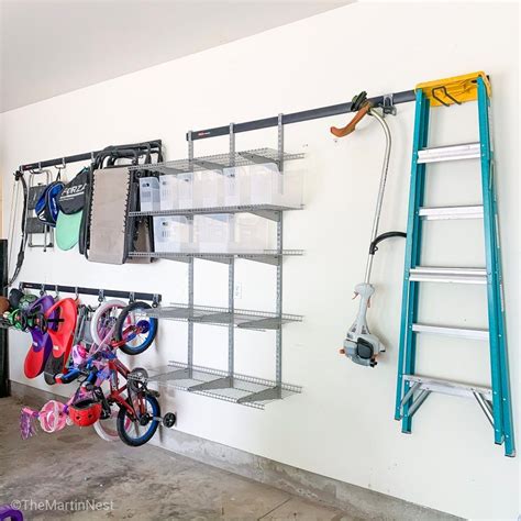 This garage organization wall track system offers flexible storage for