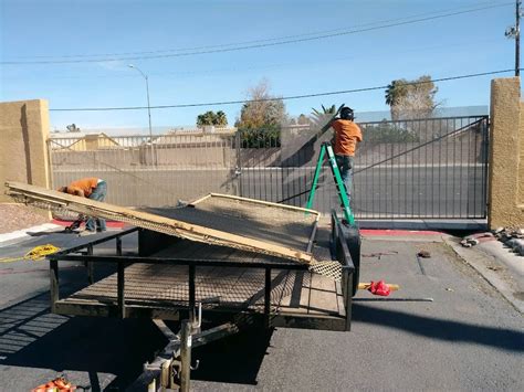 Repairman Inspecting Gate