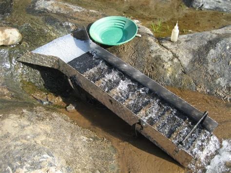 Close-up of a gem mining sluice box in action