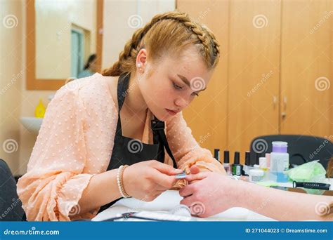 Girl Enjoys Process Creating Manicure