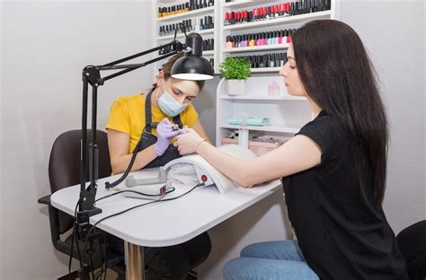 Girl Master Makes Manicure Client