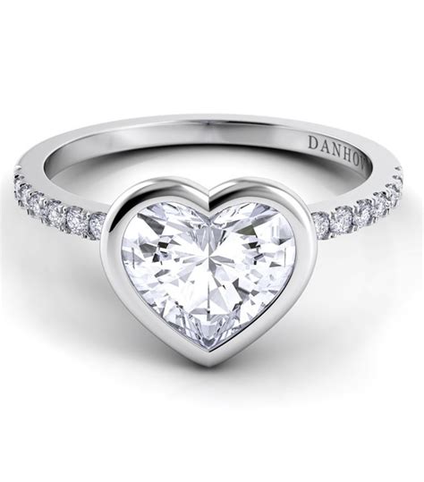 Giving a diamond ring of heart shape is the most romantic gift which your woman will love.