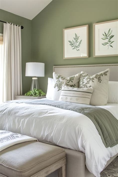 Green and grey bedroom with artwork