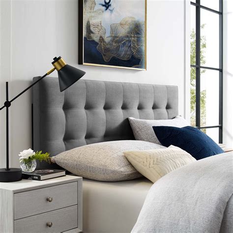 Grey bedroom with a white tufted headboard
