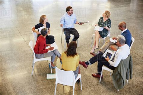 Group of people sitting in a circle talking