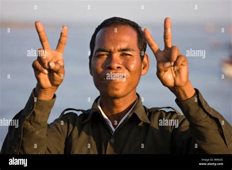Guy Crying Holding Up Peace Sign