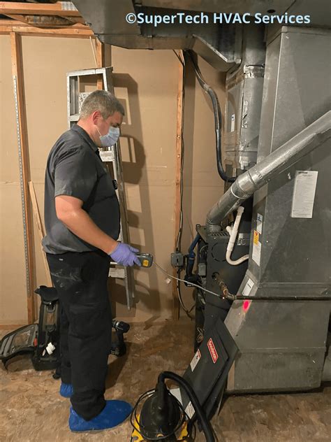 HVAC technician checking a furnace
