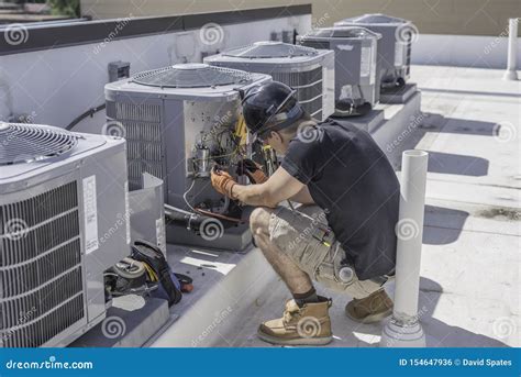 HVAC technician checking a unit