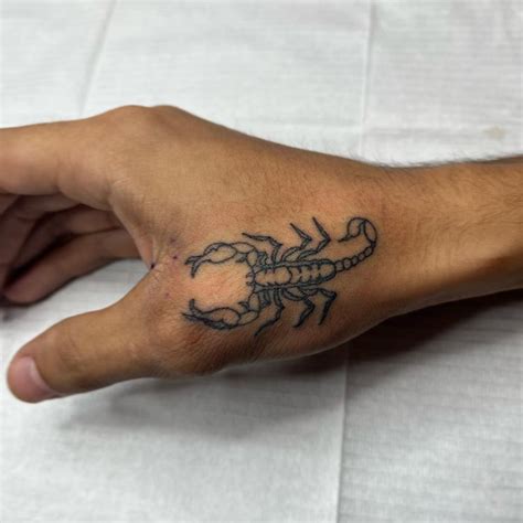 Hand Scorpion Tattoos