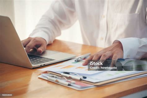 Image of hands working on a spreadsheet