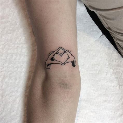 Heart With Hands Tattoo