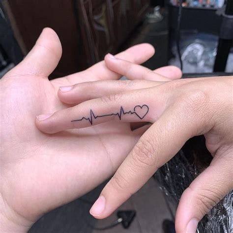 Heartbeat Tattoo On Finger