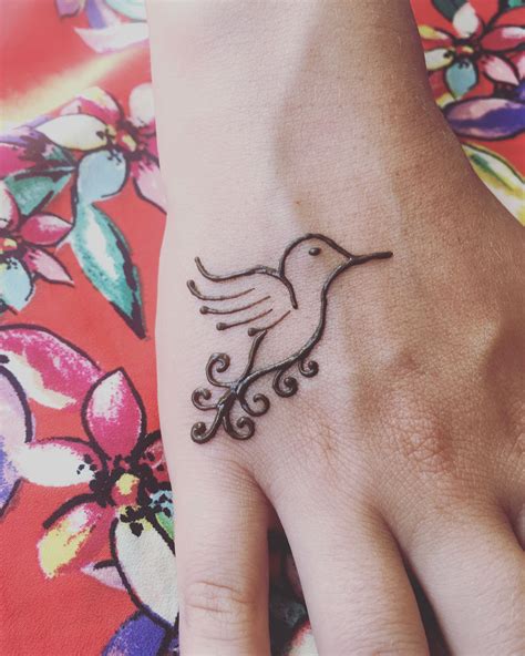 Fantastic henna style upper back tattoo of beautiful bird