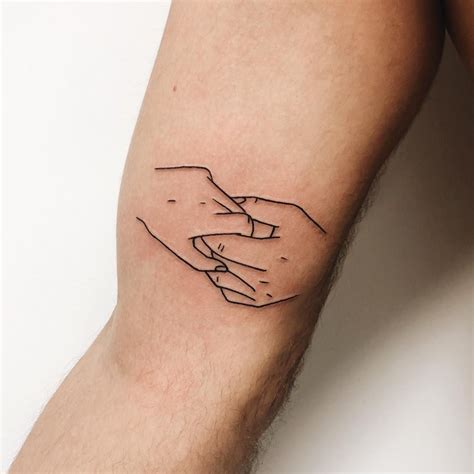 Holding Hands Tattoo. Relive the moment when you first