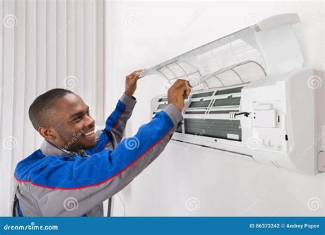 Homeowner Checking Air Conditioner