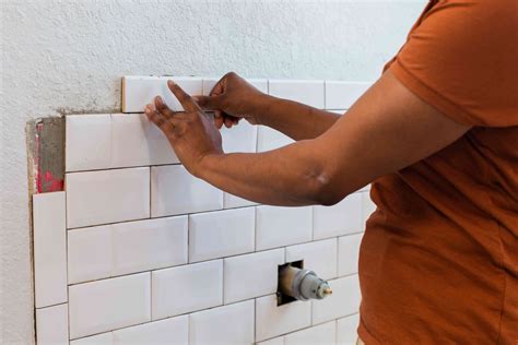 Installing the Tiles on the Wall. Stock Photo Image of flat, plastic 81276526