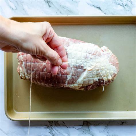 Step-by-Step Guide on How to Masterfully Tie a Pork Shoulder for Perfect Roasting