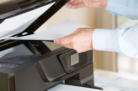 How to load paper in a copy machine