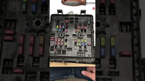 How to remove an under-hood fuse box