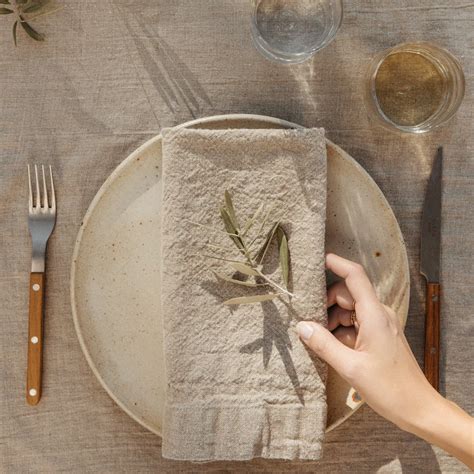 How to use napkins when setting a table