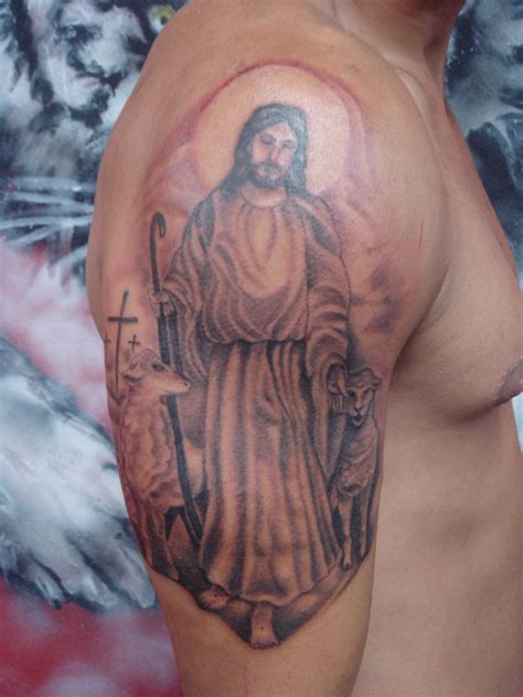 Jesus carries his cross forearm tattoo