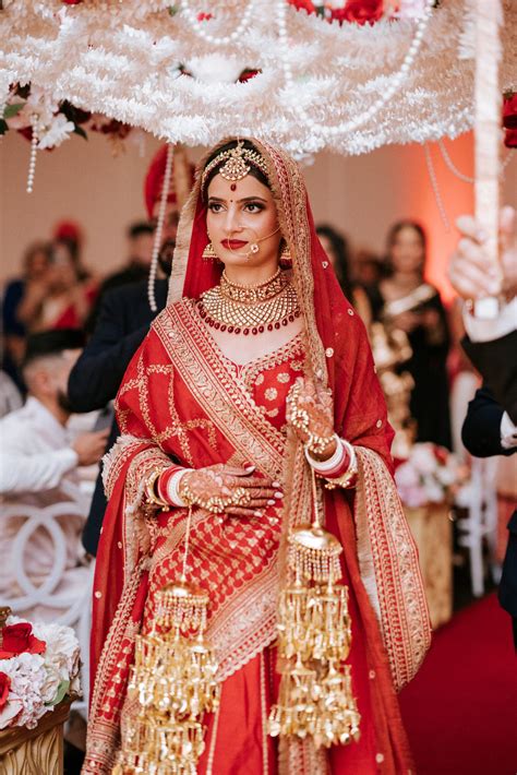 Indian bridal costume gives beguiling look to bride