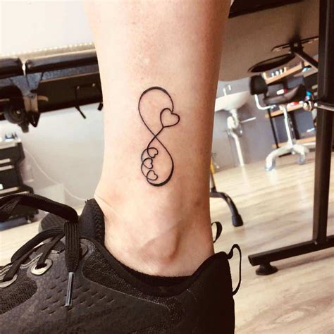 Infinity Sign With Hearts Tattoo
