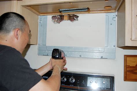 Install the Microwave onto the Mounting Bracket