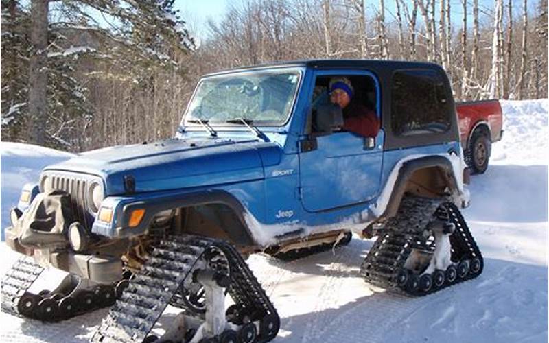 Jeep Wrangler In Snow With Tracks