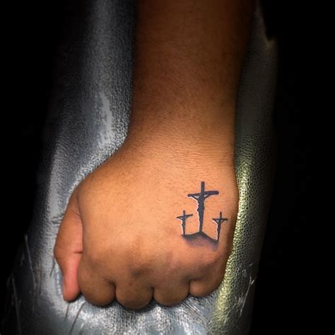 Jesus Cross Hand Tattoo