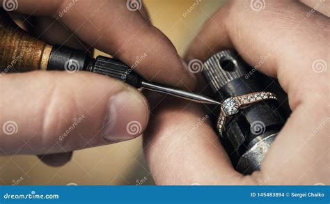 Jeweler Repairing a Ring