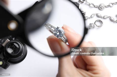Jeweler examining a ring