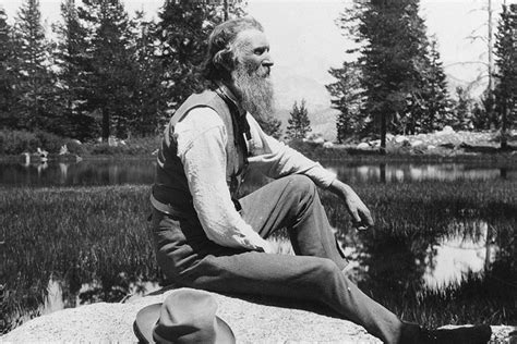 John Muir sitting under a tree