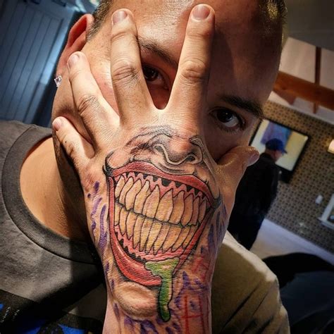 Joker Smiling Hand Tattoo