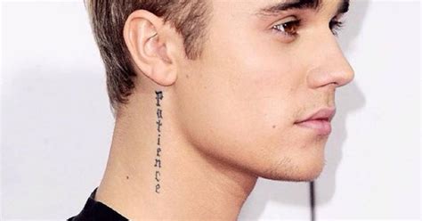Justin Bieber’s neck tattoos on gray Behind ear tattoos