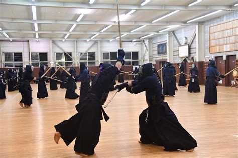 Participants practicing kendo techniques during a training session