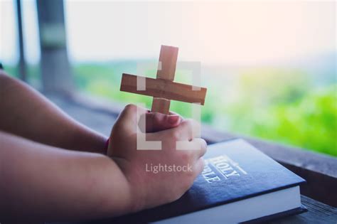Kid Holding Up Cross