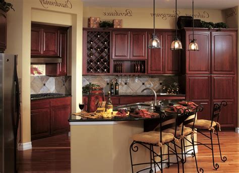 Contemporary kitchen shows overhead soffit matching island below. By Smuckler Architecture