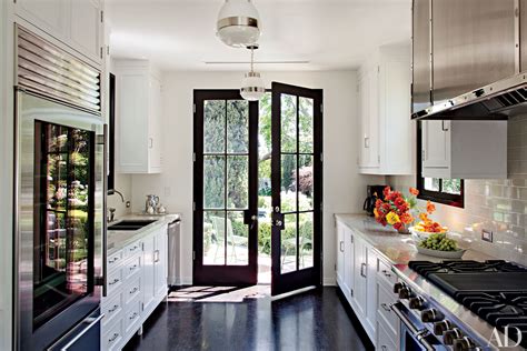 A Taste of Elegance: Discover The Delights of a Well-Designed Kitchen With French Doors Leading to Your Beautiful Patio!