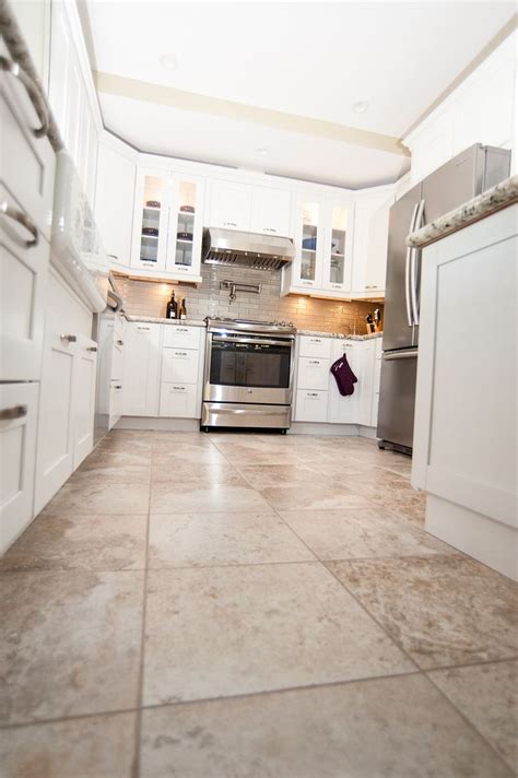 Unleash the Charm of your Cooking Space: Elevate your Kitchen with a Gorgeous Tan Tile Floor Design