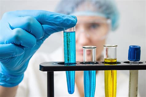 Laboratory Assistant Preparing Reagents