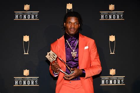 Lamar Jackson receiving awards