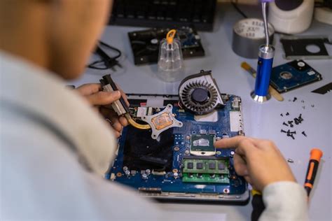 Laptop Repair Technician Working
